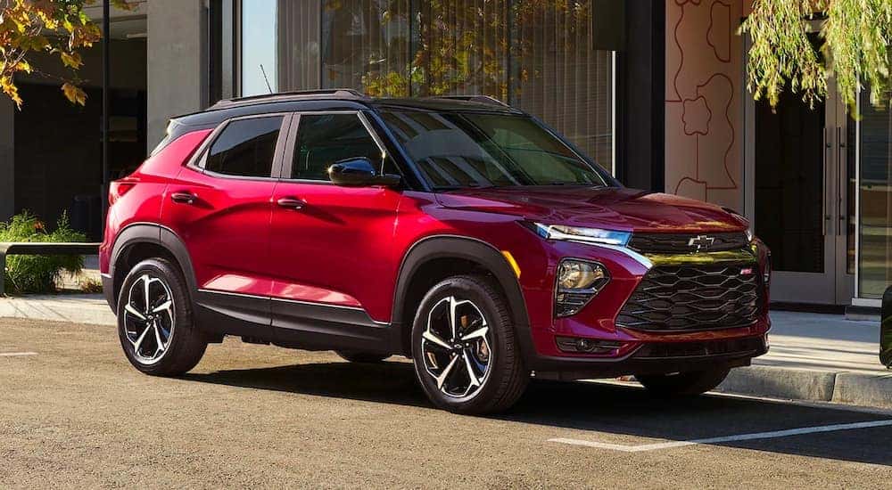 A red 2022 Chevy Trailblazer RS is shown parked on the side of a city street.