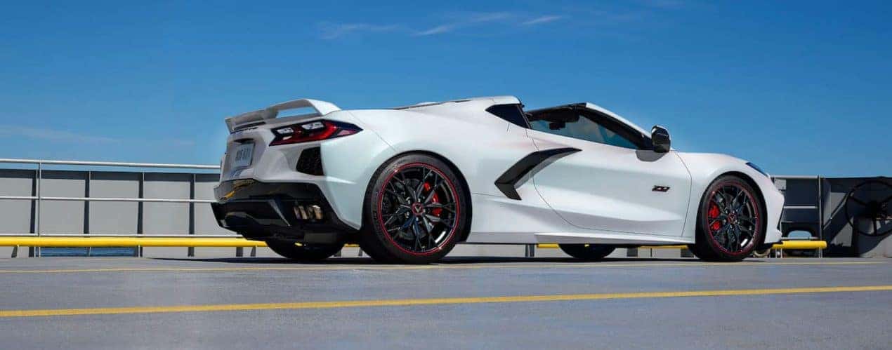 A white 2023 Chevy Corvette 3LT 70th Anniversary Edition is shown from the side.