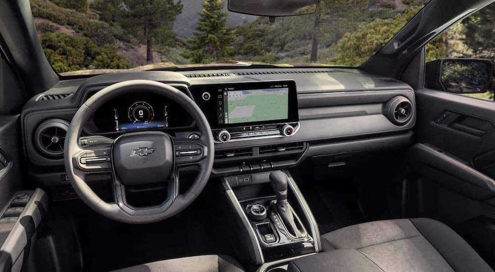 The interior of a 2023 Chevy Colorado Trail Boss is shown from the drivers seat.