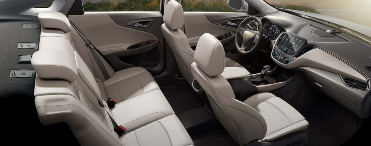 The tan interior fo a 2023 Chevy Malibu is shown during a 2023 Chevy Malibu vs 2023 Nissan Altima comparison.