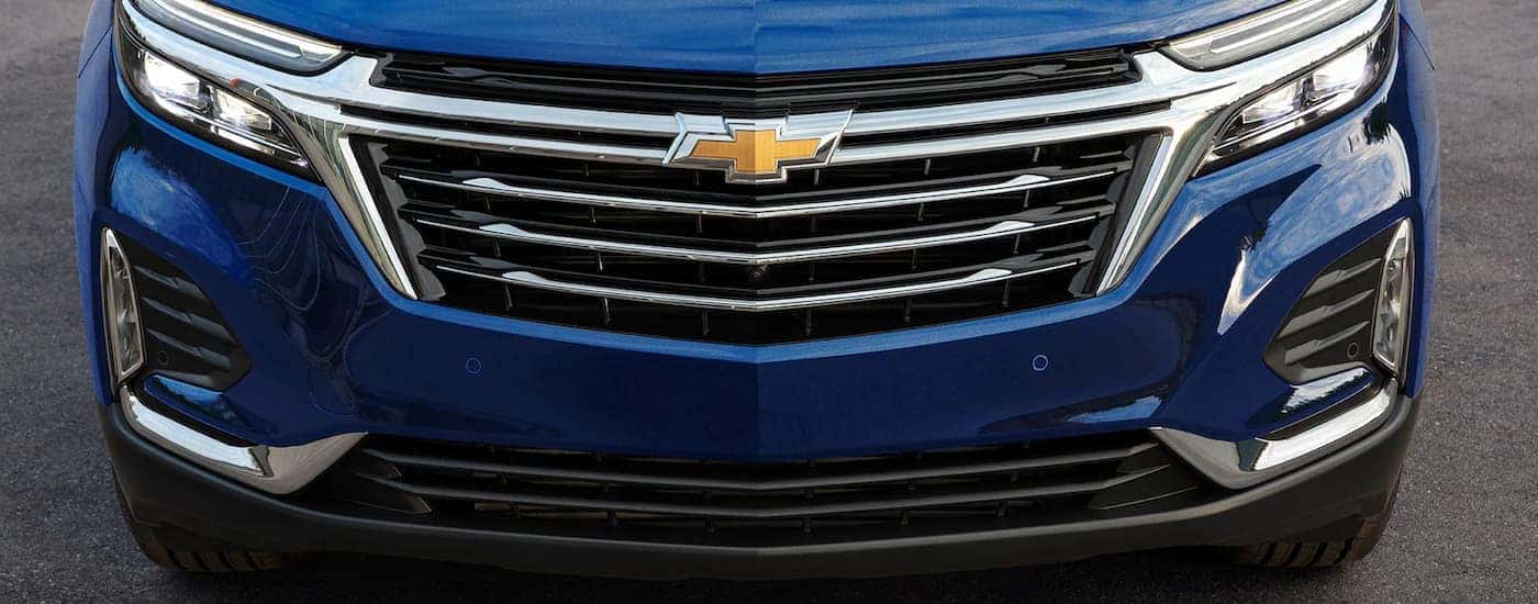 A blue 2022 Chevy Equinox Premier is shown close up.