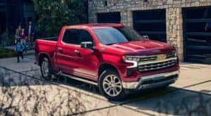 A red 2023 Chevy Silverado 1500 Z71 is shown parked in a driveway after leaving a Saratoga, NY Chevy Silverado dealer.