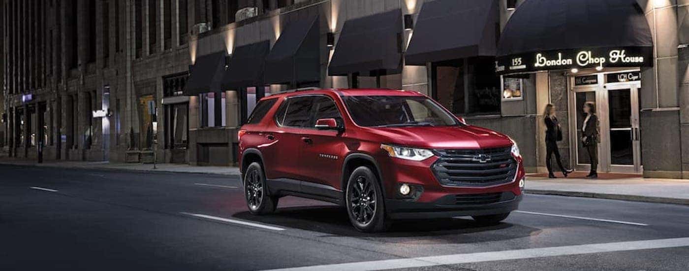 A red 2021 Chevy Traverse RS is shown from the front at an angle.
