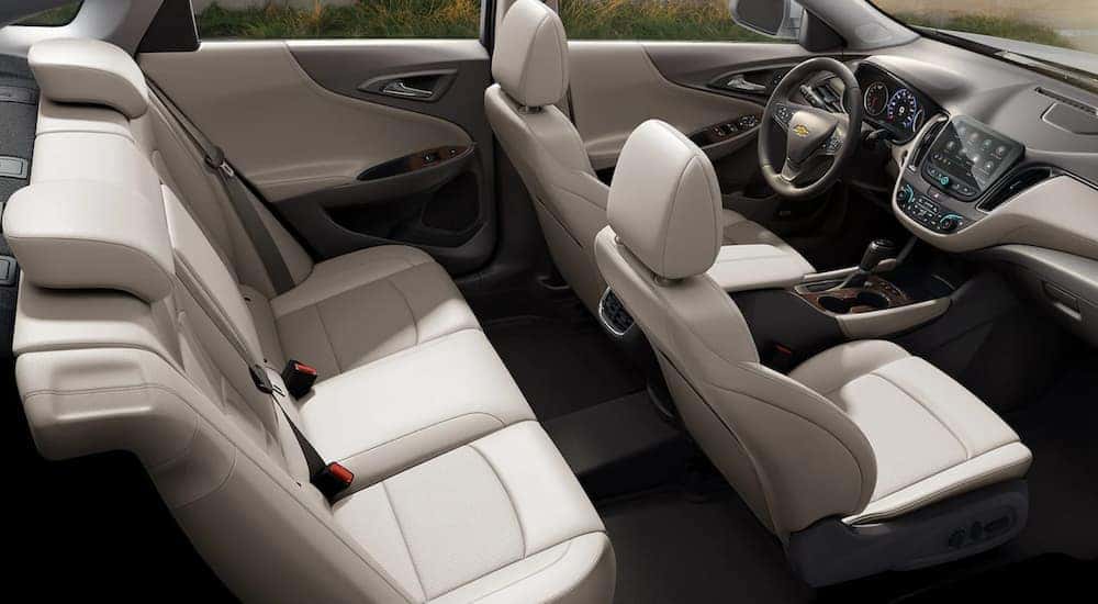 The white interior of a 2021 Chevy Malibu is shown from a high angle.
