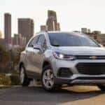A silver 2021 Chevy Trax is shown from the front at an angle after leaving a dealer that has used cars for sale.