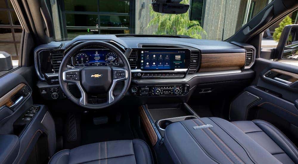 The interior of a 2024 Chevy Silverado 2500 HD High Country is shown from the driver's seat.