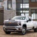 A white 2024 Chevy Silverado 3500 HD is shown from the front at an angle.
