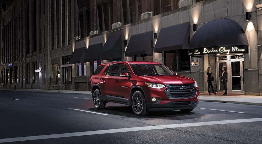 A red 2021 Chevy Traverse RS is shown from the front at an angle.