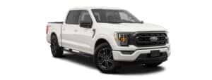 A white 2023 Ford F-150 is angled right.