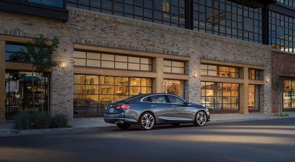 A grey 2021 Chevy Malibu is shown from the rear at an angle.