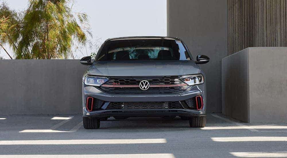 A grey 2022 Volkswagen Jetta GLI is shown from the front while parked after leaving a dealer that has used cars for sale near Schenectady.