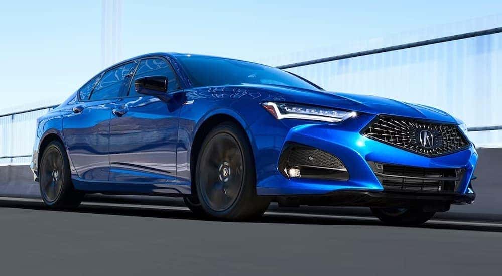 A blue 2022 Acura TLC A-Spec is shown from the front at an angle.