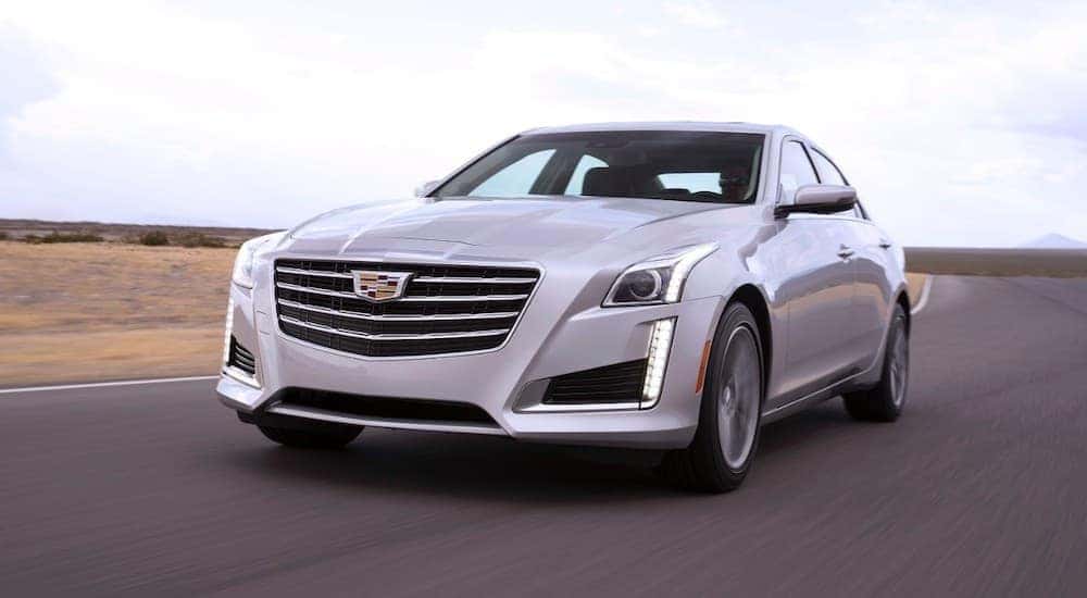 A white 2018 Cadillac CTS is shown from the front at an angle after leaving a dealer that has used cars for sale near Latham.