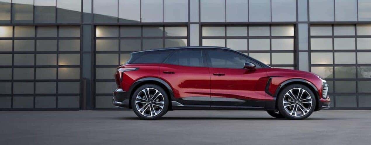 A red 2024 Chevy Blazer EV SS is shown from the side while parked.