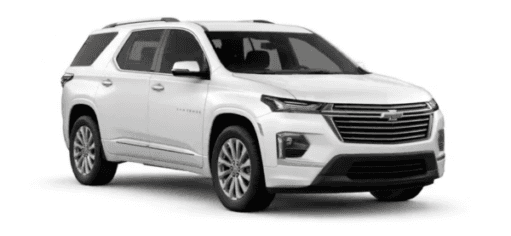 A white 2023 Chevy Traverse is shown angled right.
