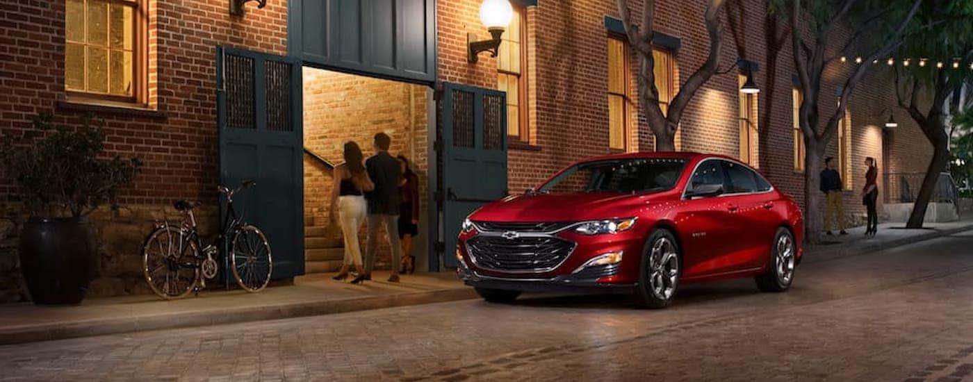 A red 2019 Chevy Malibu RS is shown from the front at an angle.