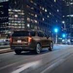 A brown 2022 Chevy Tahoe RST is shown from the rear at an angle.