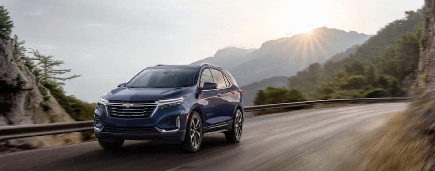 A blue 2022 Chevy Equinox Premier is shown from the front at an angle.