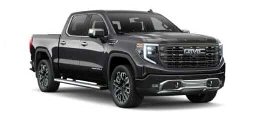 A dark grey 2024 GMC Sierra 1500 Denali is shown angled right.