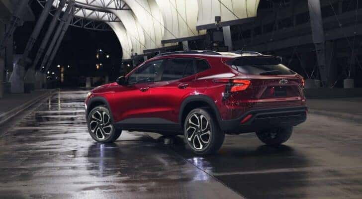 A red 2024 Chevy Trax RS is shown from the rear at an angle.