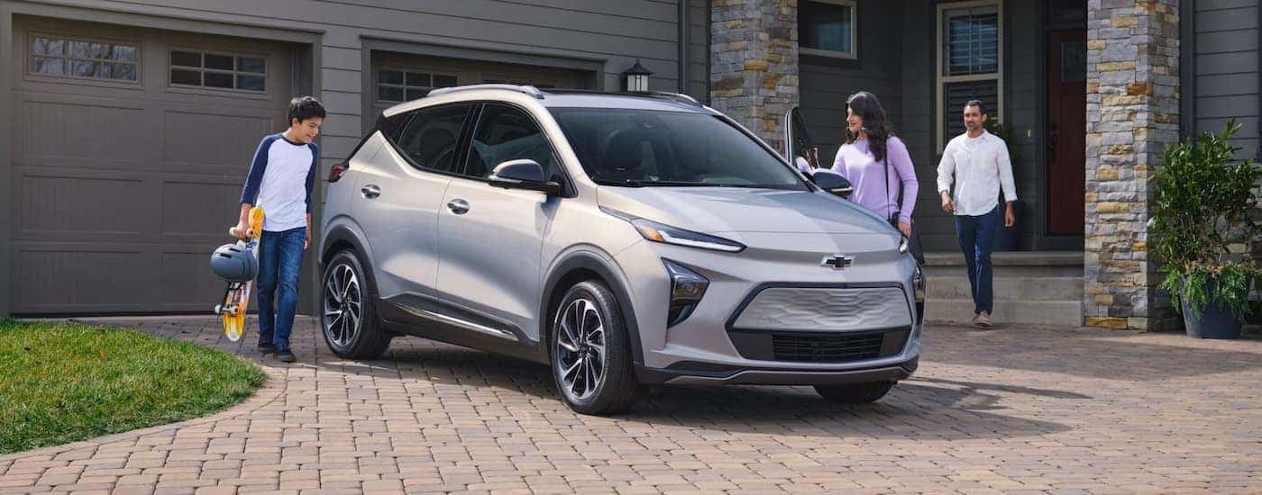 A grey 2023 Chevy Bolt EUV is shown parked in a driveway.