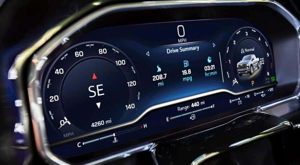 A close-up on the electronic gauges inside a 2024 Chevy Silverado 1500 LT is shown.