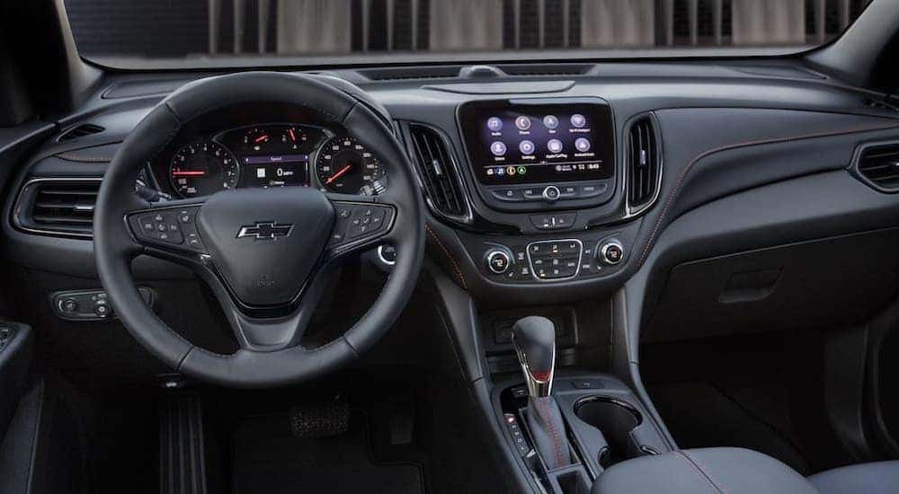 A black 2022 Chevy Equinox RS is shown from the driver's seat.