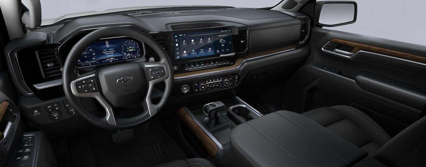 The black interior and dash in a 2023 Chevy Silverado RST, is shown.