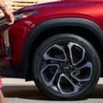 A close-up on the front wheel of a red 2024 Chevy Trax RS.