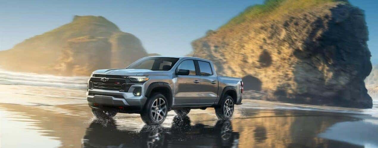 A silver 2024 Chevy Colorado Z71 is shown driving on water.
