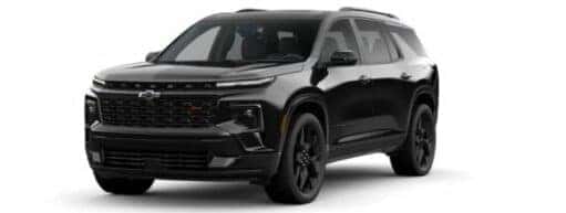 A black 2024 Chevy Traverse RS is angled left.
