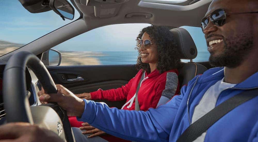 Two people are driving in a 2024 Chevy Trax.