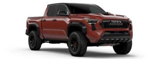 A red 2024 Toyota Tacoma is angled right.