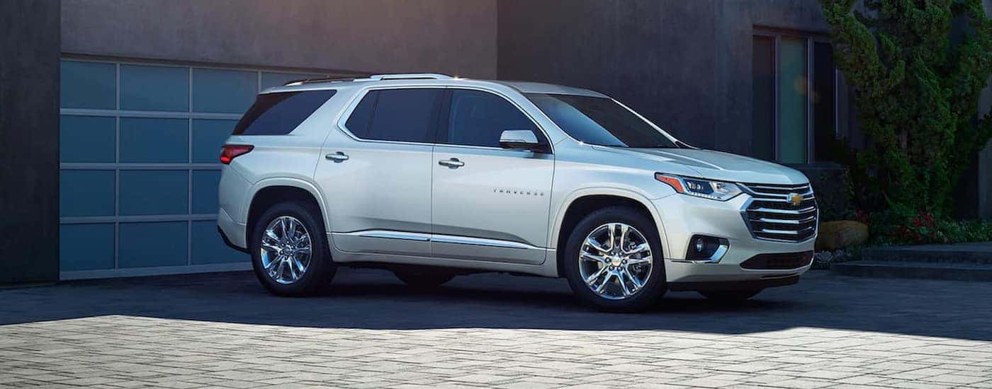 A silver 2020 Chevy Traverse is shown parked on a driveway.