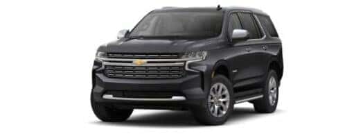 A black 2024 Chevy Tahoe Premier is angled left.