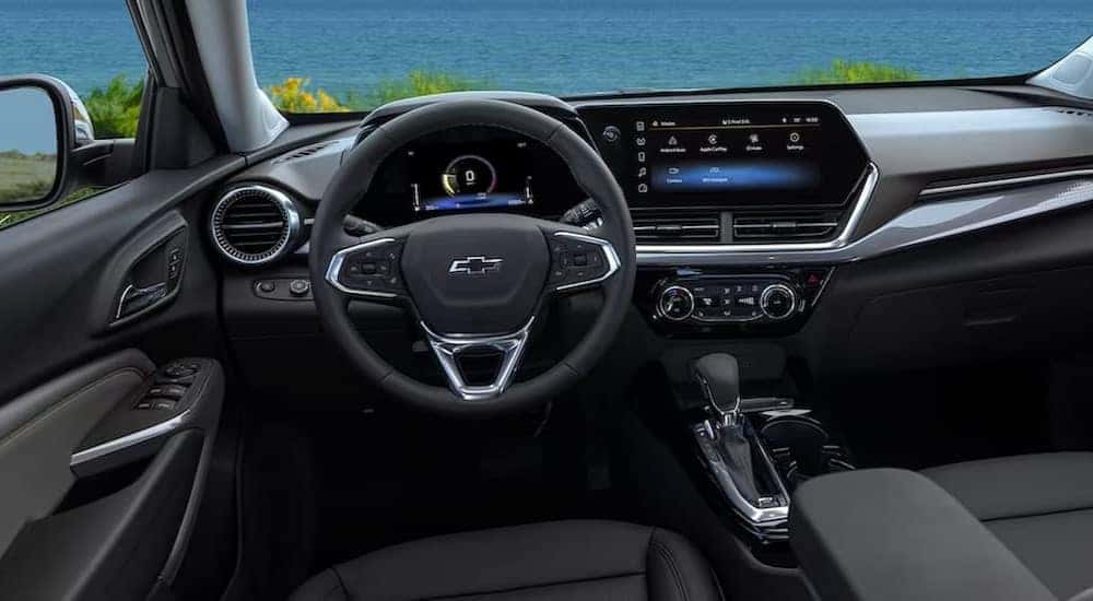 The black interior and dash in a 2024 Chevy Trax is shown.