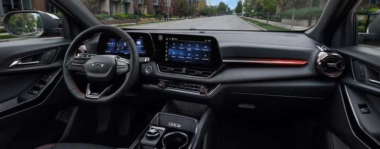 The black wheel and dashboard of a 2025 Chevy Equinox.