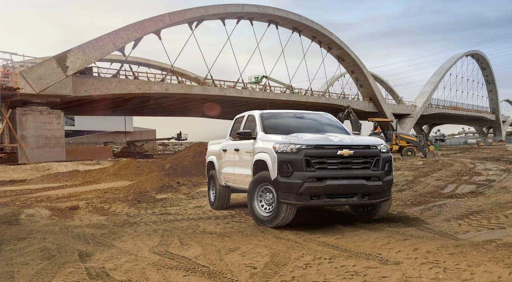 A white 2023 Chevy Colorado WT for sale is shown from the front at an angle.