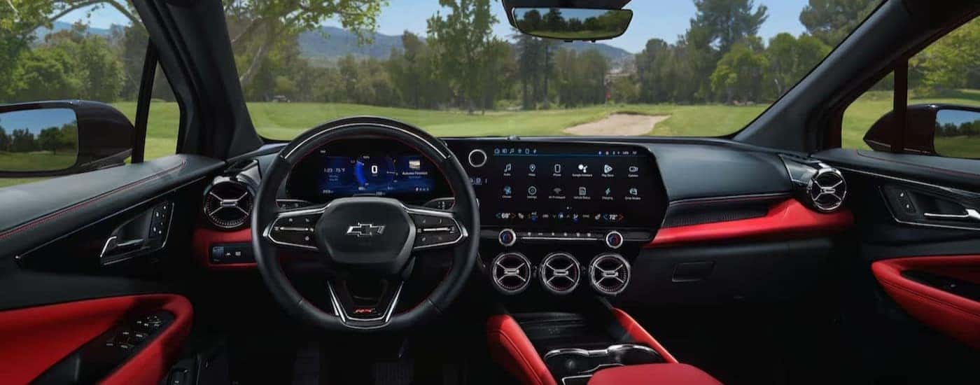 The black and red interior and dash in a 2024 Chevy Blazer EV for sale in Albany is shown.