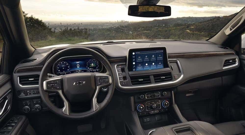 The gray interior and dash is shown in a 2024 Chevy Tahoe for sale in Albany.