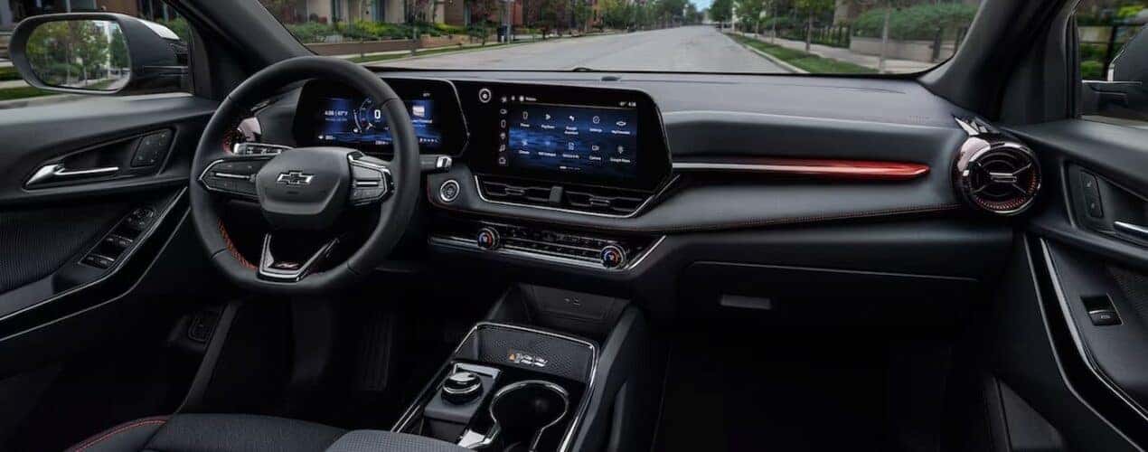 The black interior and dash in a 2025 Chevy Equinox is shown.
