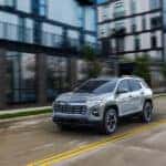A silver 2025 Chevy Equinox LT is shown from the front at an angle during a 2025 Chevy Equinox vs 2025 Honda CR-V comparison.