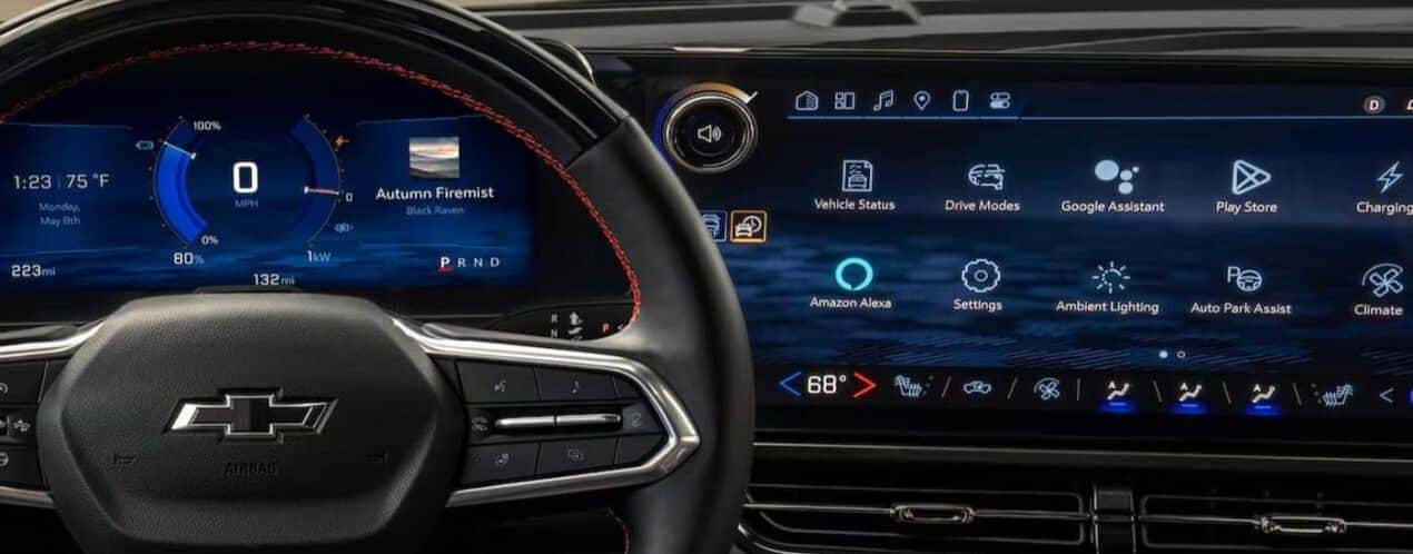 A close-up of the steering wheel and digital dash is shown in a 2025 Chevy Equinox.
