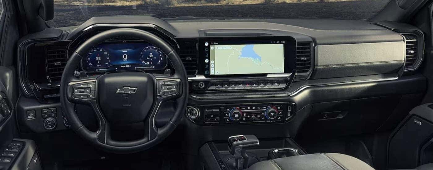 The black interior and dash are shown in a 2024 Chevy Silverado 1500.
