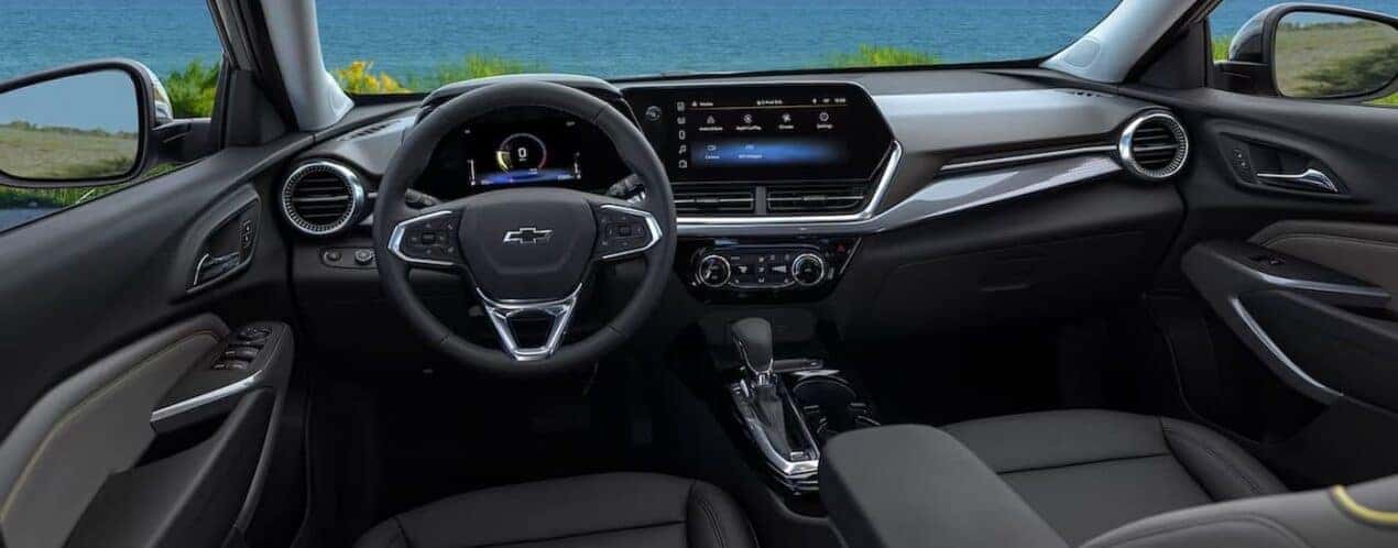 The black interior and dash are shown in a 2025 Chevy Trax.