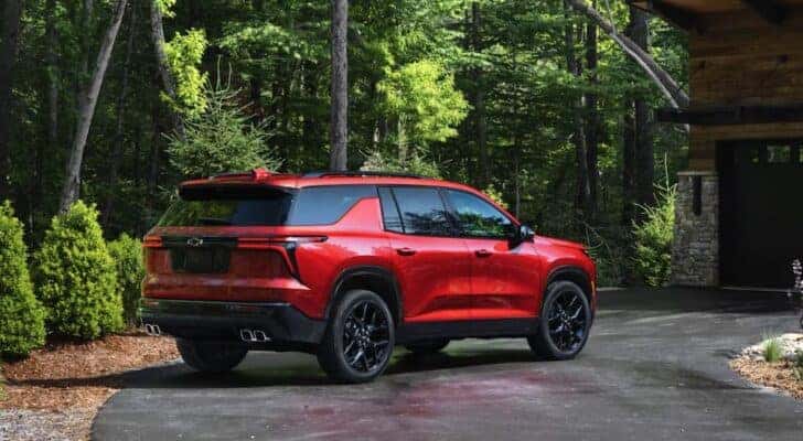 A red 2025 Chevy Traverse RS is shown parked after viewing a Chevy Traverse for sale near Latham.