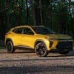 A yellow 2025 Chevy Trax ACTIV is shown from the front at an angle.