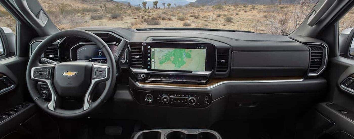 The black interior of a 2024 Chevy Silverado 1500 for sale near Colonie is shown.