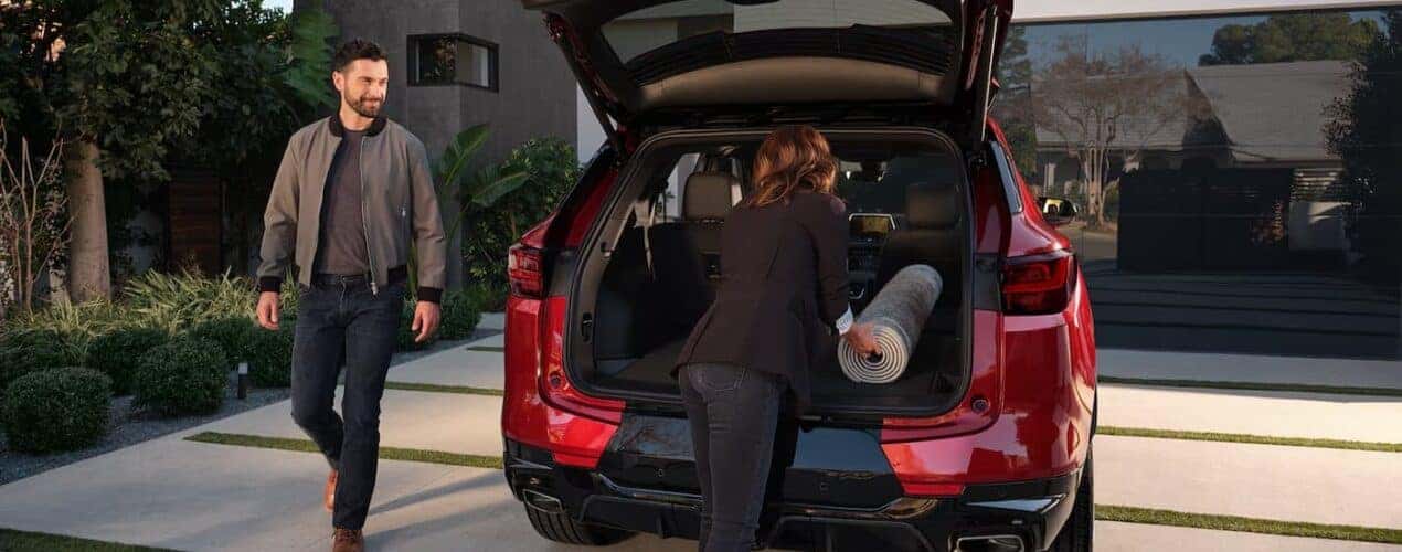 The rear cargo area is shown in a red 2025 Chevy Blazer RS.