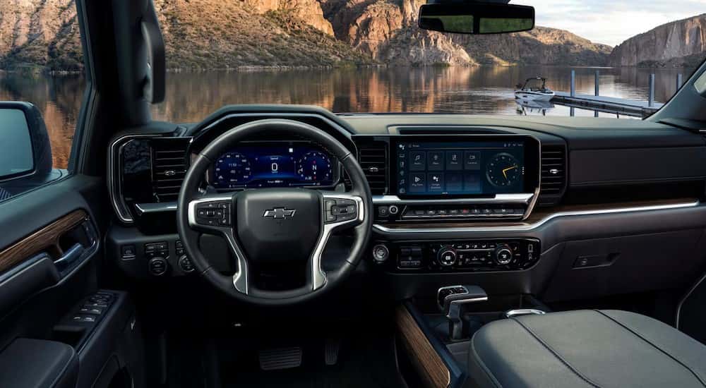 The black interior and dash are shown in a 2025 Chevy Silverado 1500 for sale near Colonie.